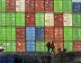 Dockworkers secure lines from a container ship at the Port of Oakland on Friday, April 4, 2025, in Oakland, Calif. (AP Photo/Noah Berger)