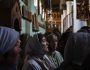 In this photo taken Sunday, Dec. 9, 2013, churchgoers sing together as they leave a service at Saint Catherine's Monastery, also known as Santa Katarina, at the foot of Mount Sinai in Saint Catherine in the Sinai peninsula, Egypt. The monastery is Greek Orthodox and is a UNESCO World Heritage Site. (AP Photo/Hiro Komae)