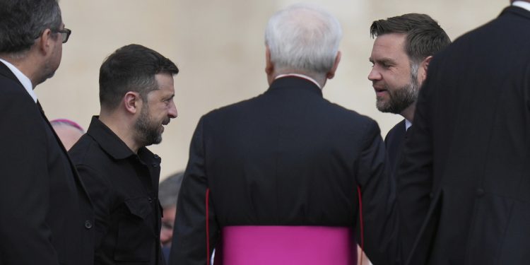 Ukraine's President Volodymr Zelenskyy, left meets Vice President JD Vance as they arrive to attend Pope Leo XIV's formal inauguration of his pontificate in St. Peter's Square at the Vatican, Sunday, May 18, 2025. (AP Photo/Alessandra Tarantino)